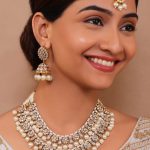 White Gold-Plated Kundan Pearl Necklace Set with Maang Tikka and Jhumki Earrings