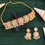 Elegant Gold Plated Kundan Choker Necklace Set with Floral Motifs, Pearls, and Matching Earrings - Perfect for Festive Wear.